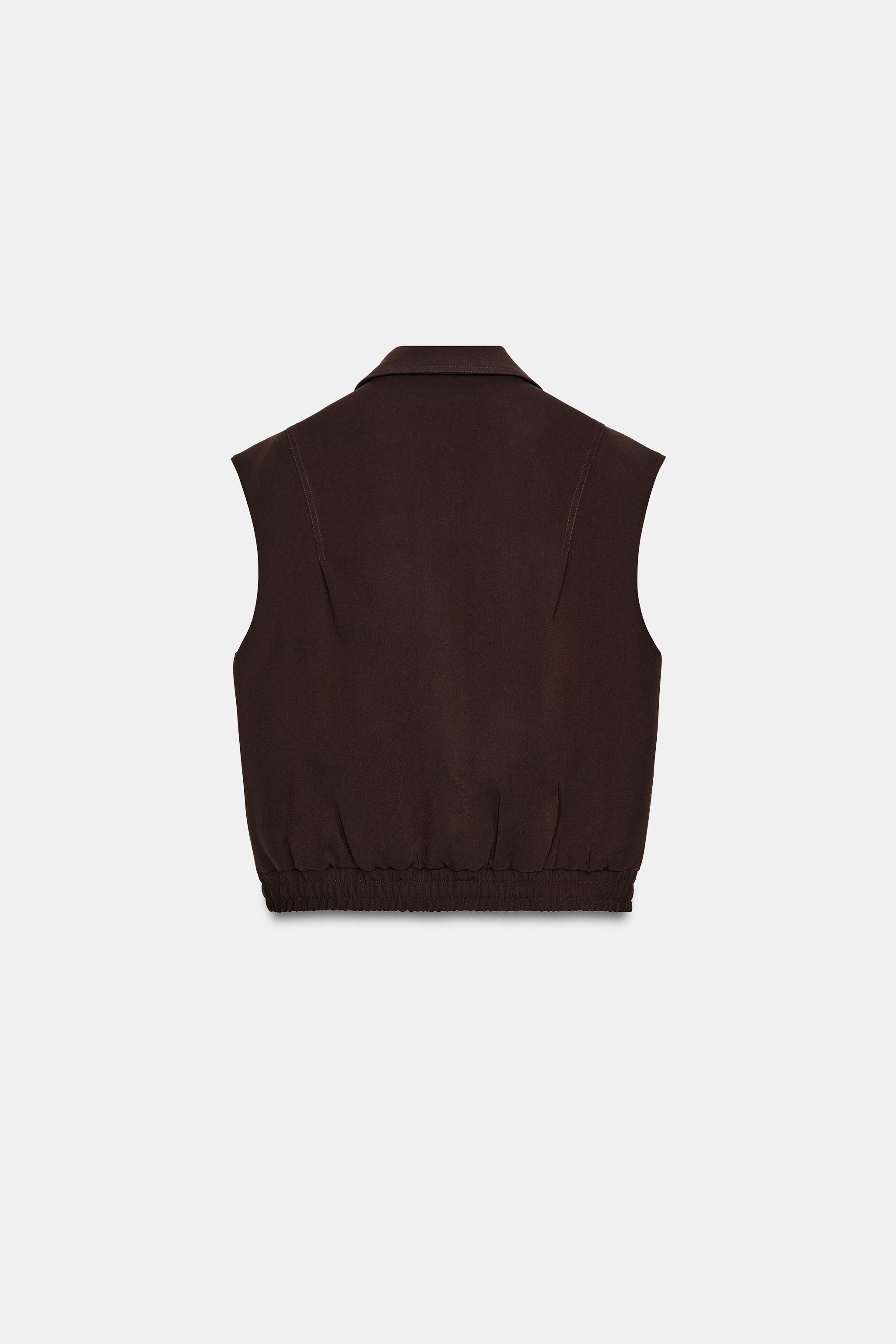 GILET À ÉPAULETTES AVEC BAS ÉLASTIQUE